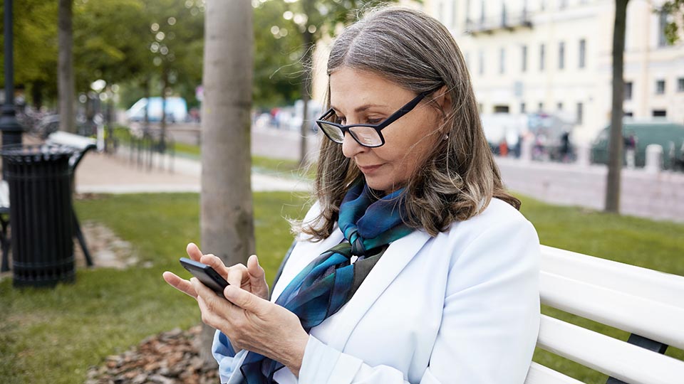 A woman uses a health app on her phone